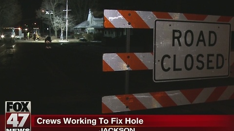 Crews working to fix hole in Jackson