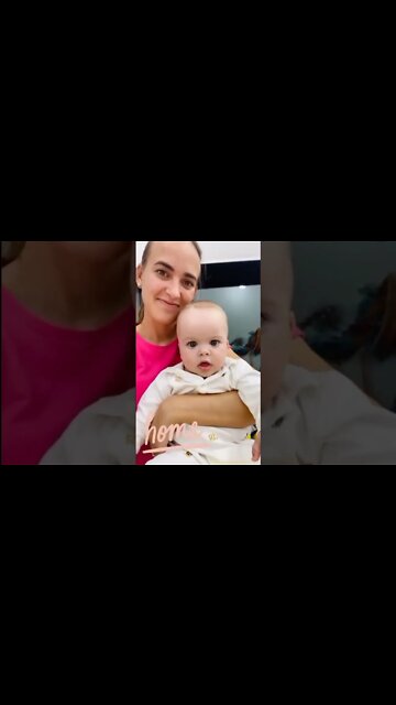 Cute adorable baby child with warm white and pink hat with cute baby girl