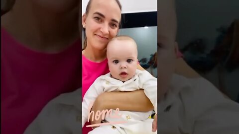 Cute adorable baby child with warm white and pink hat with cute baby girl