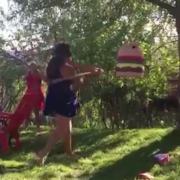 Girl Fails To Hit Hamburger Pinata