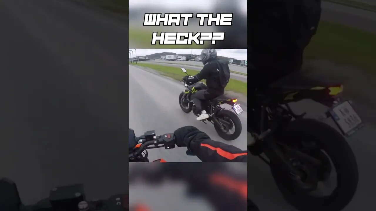 Biker slaps another biker's mirror!