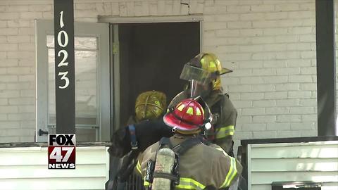 Firefighters save residents, two dogs from fire in Lansing