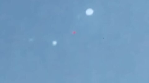more storm UFOs/ spheres close to jet trail