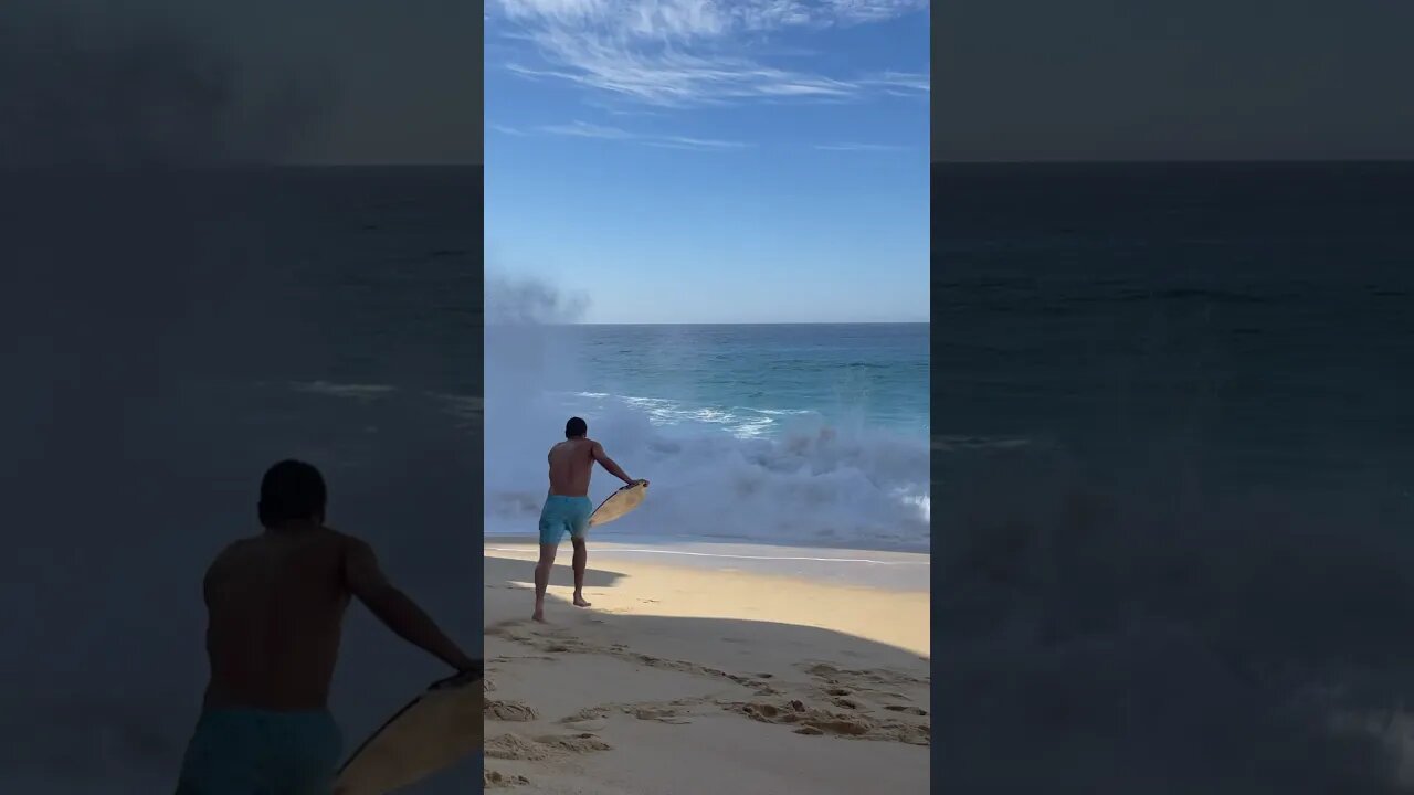 SKIMBOARDER CHARGES BIG WAVES