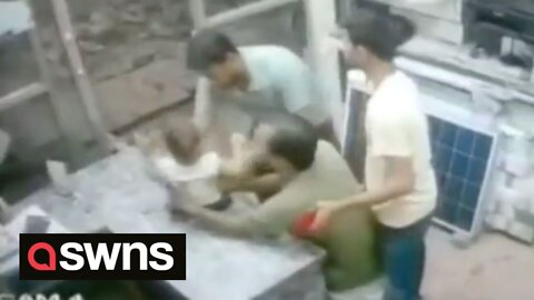 A man and child miraculously survived - after falling construction debris missed them by inches