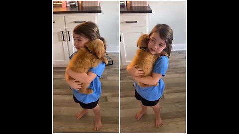 Little girl sobs as she holds her new Puppy