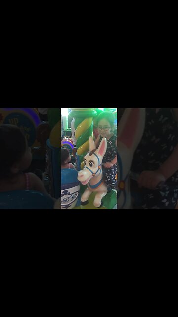 Cute babies have a good time on the merry-go round- Philippines 2017