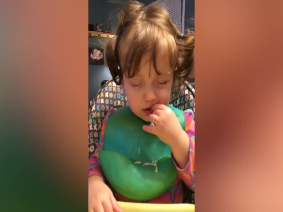 Sleepy Girl Keeps Eating her Dinner