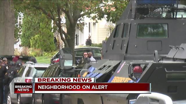 SWAT, police outside home where Cleveland officer who broke GPS monitor is believed to be hiding