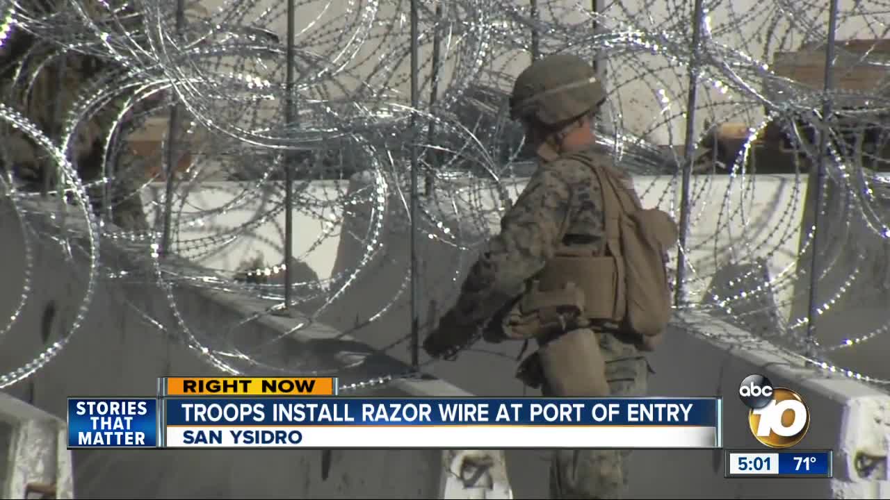 Troops install razor wire at port of entry