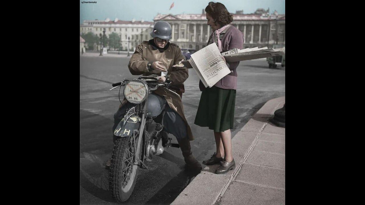 A German soldier on a motorcycle buys a newspaper on Place de la Concorde in Paris, 1942.