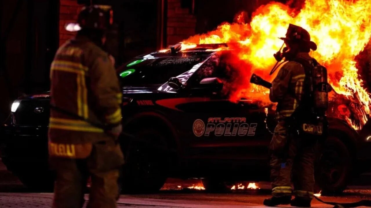 Six arrested after protesters riot, set police car on fire in Atlanta