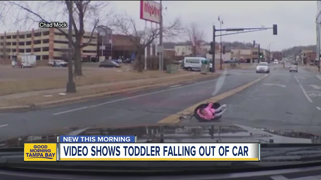 Shocking dash cam video shows toddler in car seat fall out of moving car