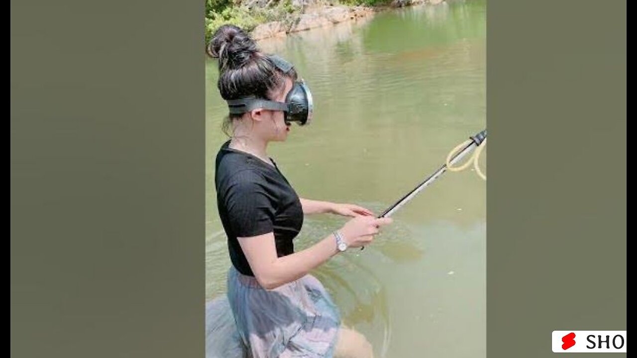 Asian girl spear fishing