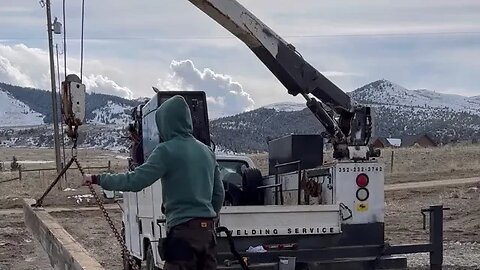 Pulling a wood beam out the mud and snow!