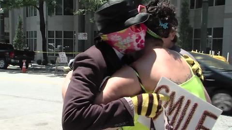 Masked man helps people in need in KC
