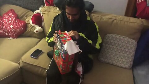 My friend Ken opens my Christmas present to him!