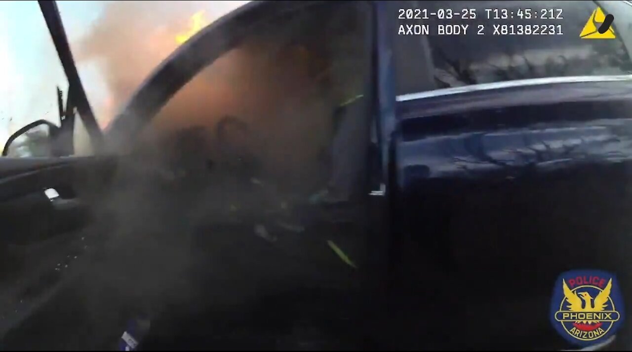 Officers Rescue Unresponsive Driver From Burning Car