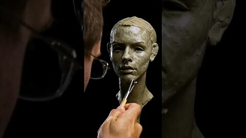 Working On Woman Portrait Sculpture.