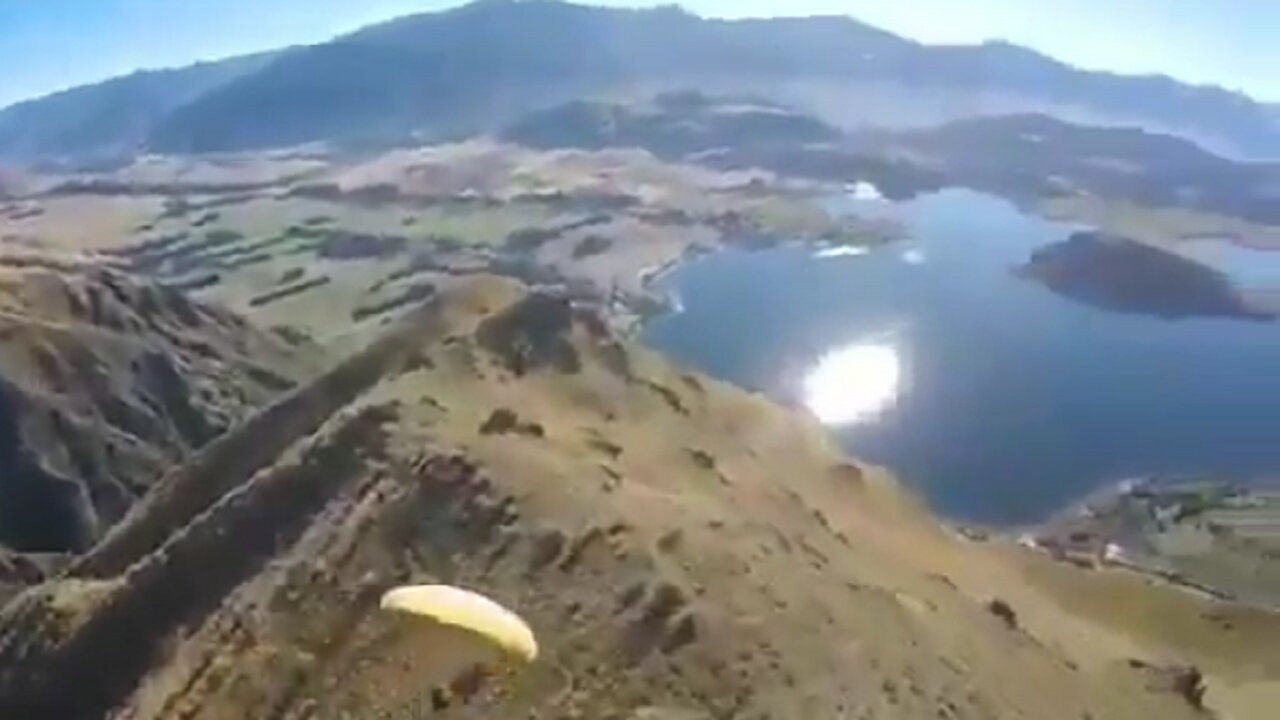 Flying on a parachute very close to hill tops