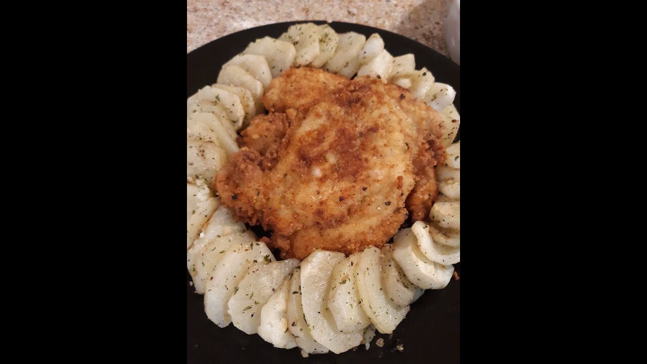 breaded chicken breast with dressed potatoe