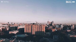 Man risks his life by somersaulting on top of building