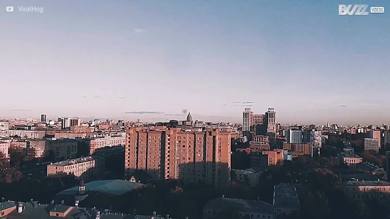 Man risks his life by somersaulting on top of building