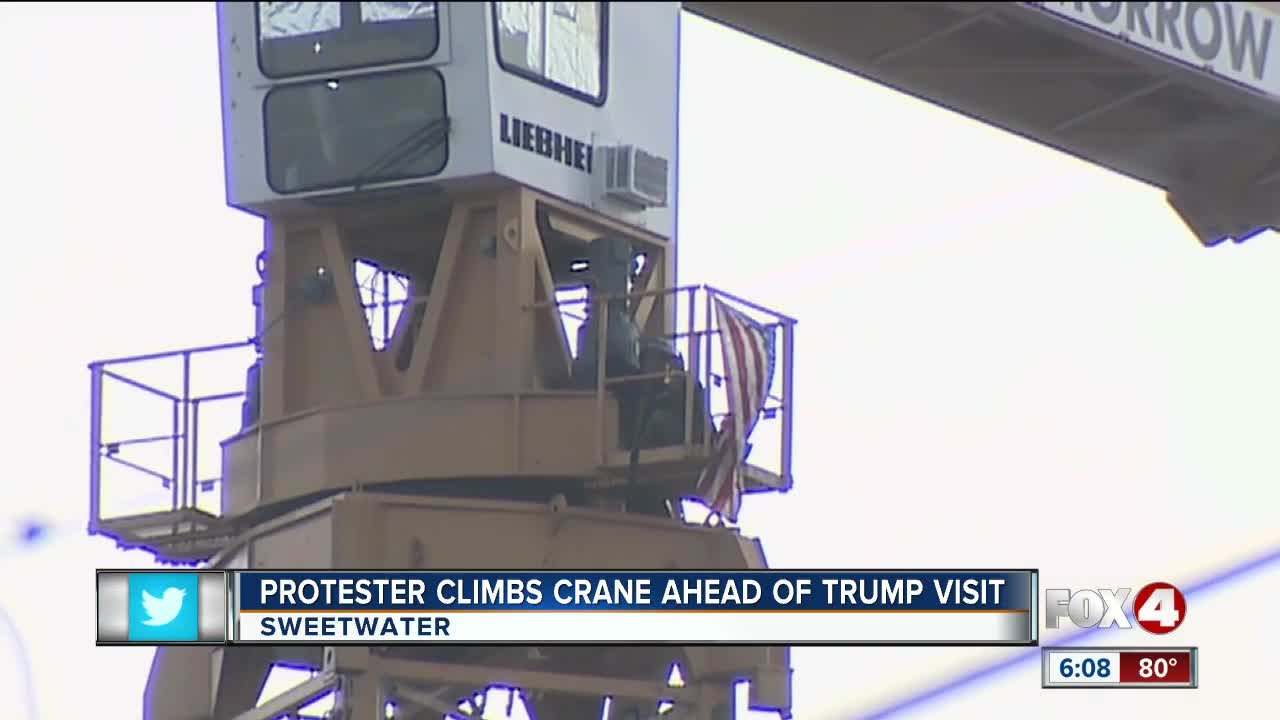 Protester climbs crane