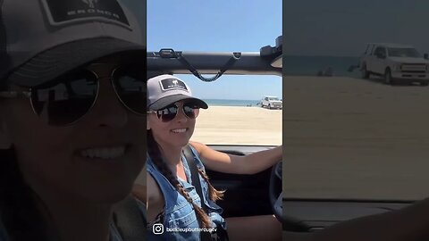 Bronco Babe Krista driving on beach in Ford Bronco