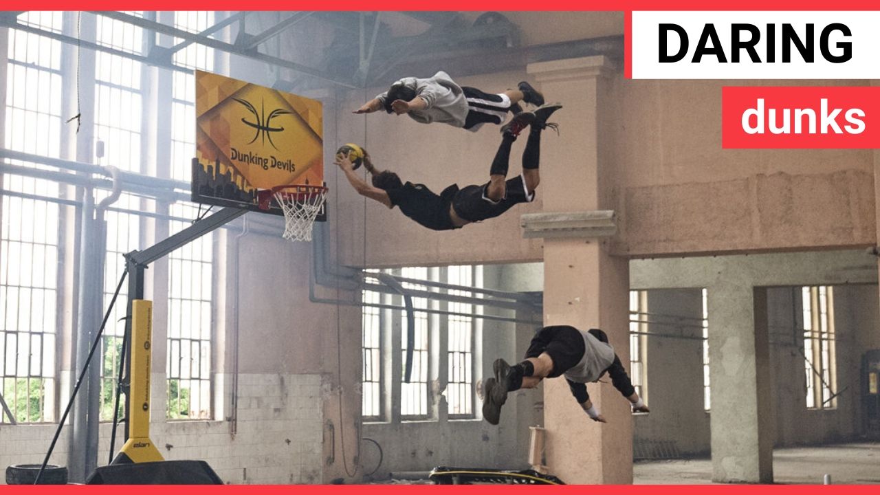 Stuntmen perform flips and basketball dunks in an abandoned playground