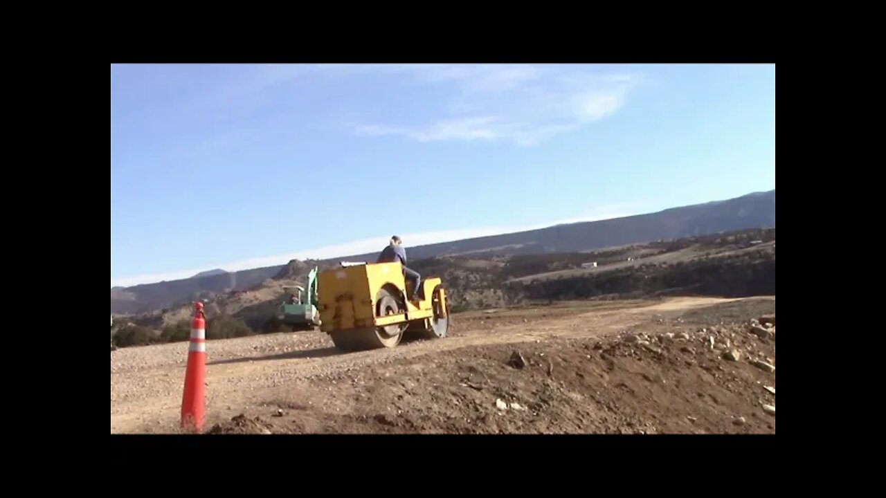 Yanmar Excavator And A Roller Rebuilding A Driveway