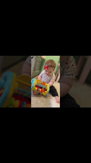 Cute adorable baby child with warm white and pink hat with cute baby girl