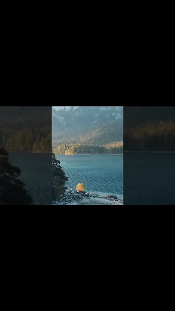 Lake Eibsee with crystal clear water is located on the border of Germany and Austria...