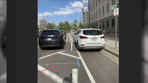 Vehicle parked in bike lane near Denver City and County Building starts conversation on safety, courtesy