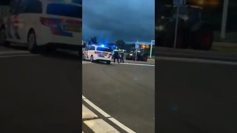 Netherlands: Police drawing gun and shooting at farmers tractor