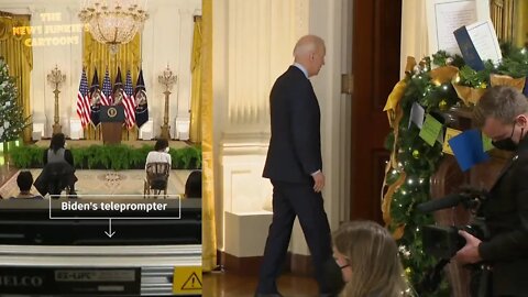 Biden walks away from literally a few people in the room.