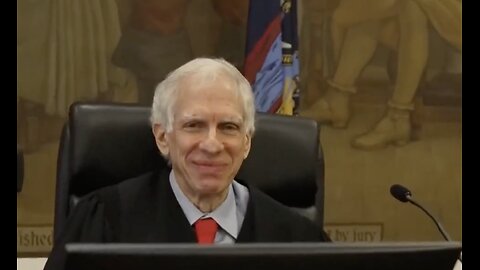 The judge in Trump's case smiles for his closeup