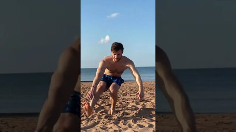 Doing a pistol squat at the beach in Canada