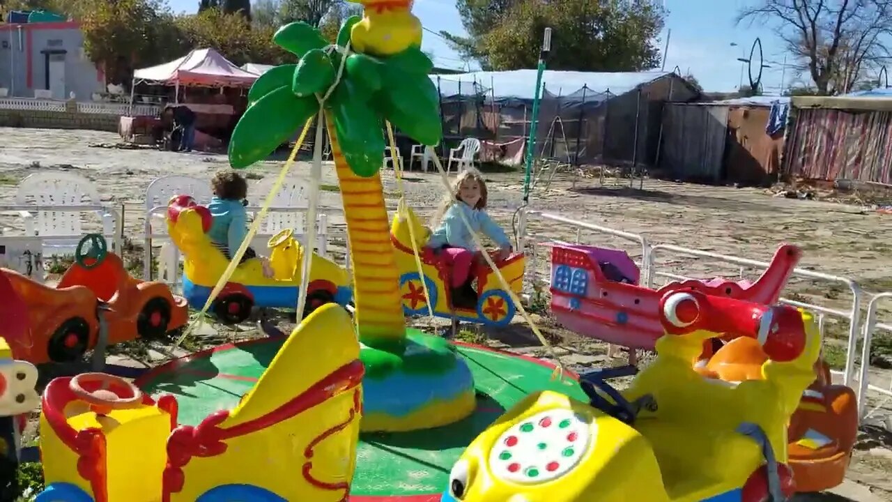 Kenza and Mary on the merry-go-round in Algeria