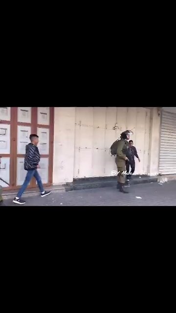 lsraeli Apartheid occupation forces detain 2 Palestinian children walking to the doctor in Hebron.