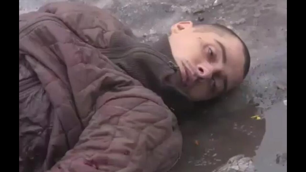 EXCLUSIVE:RUSSIAN TROOPS SHOW OFF DEAD UKRAINIANS LIKE TROPHIES.