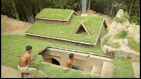 Building underground hut with grass roof & fireplace with clay