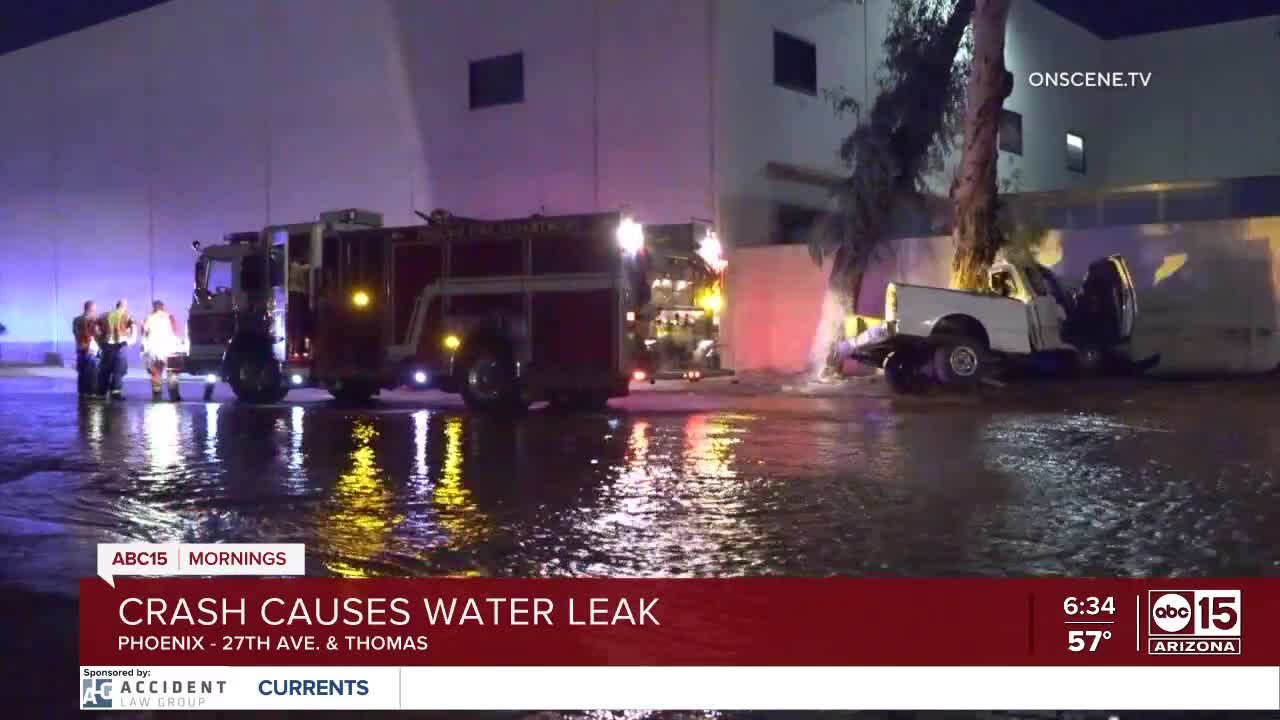 Truck crashes off road in Phoenix, causing serious flooding