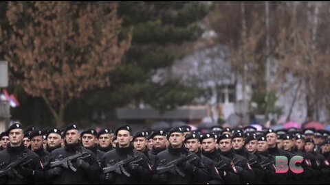 Bosnian Serbs celebrate banned holiday, praise Putin