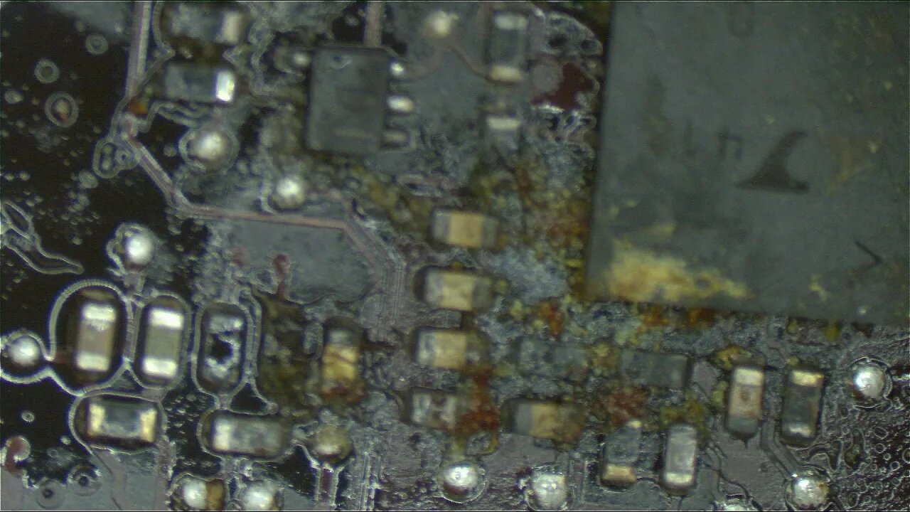 Dead Macbook Pro from feces like substance on current sensing circuit