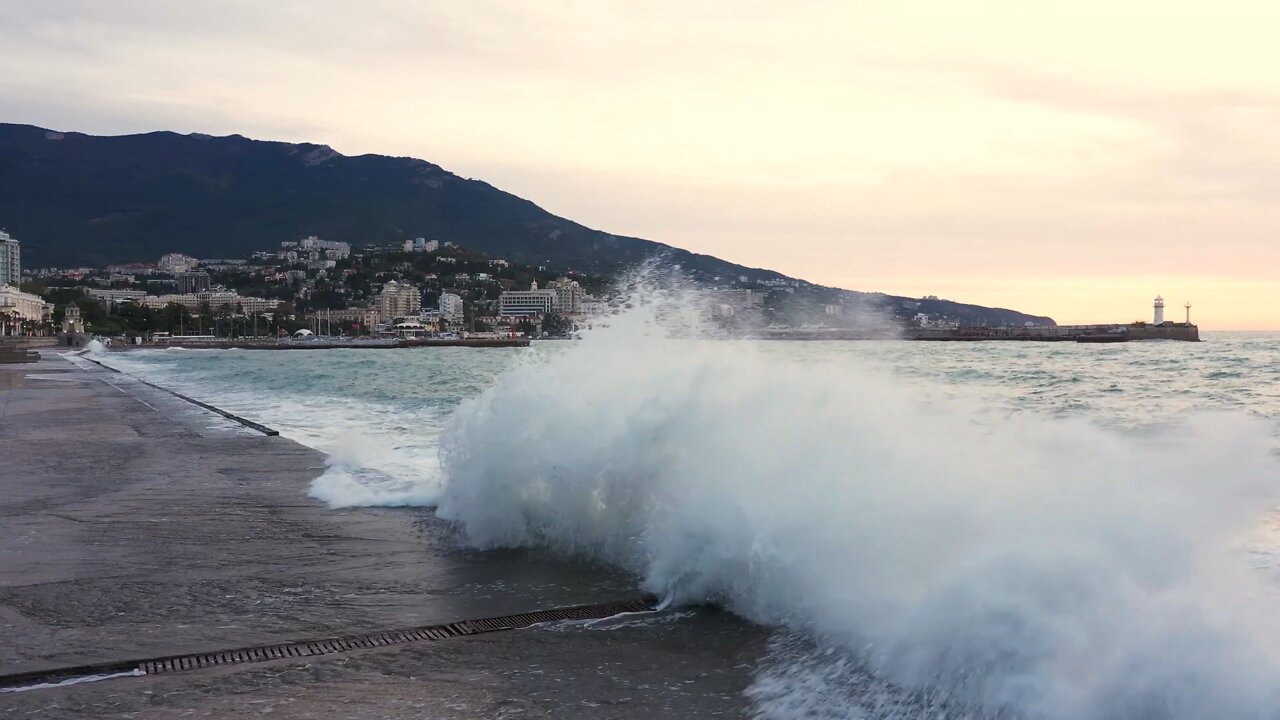 The sound of the sea for deep sleep. Waves cover the pier.