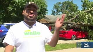 Green Bay man cleaning up storm damage after tree falls on his car and being without power