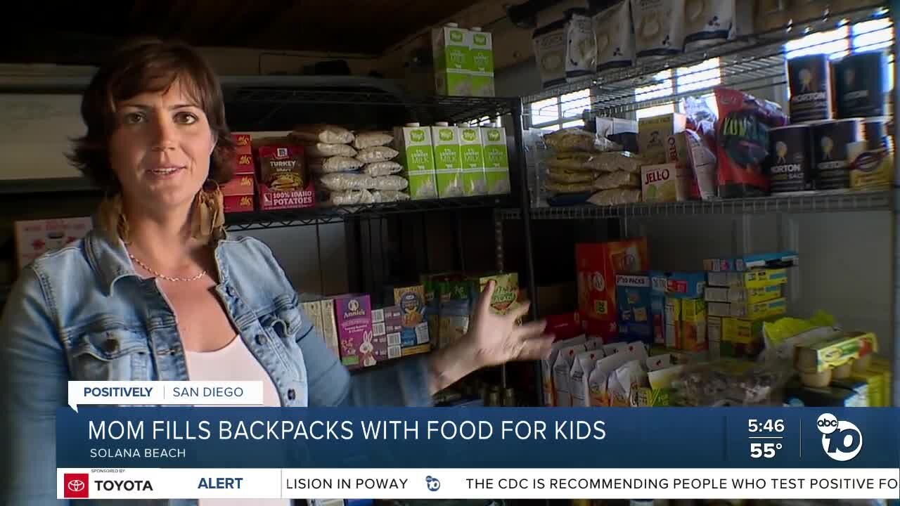 Mom fills backpacks with food for kids