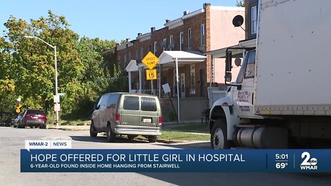 Police find six-year-old girl hanging from stairwell tangled by purse strap