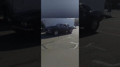 Camaro drag car drives by